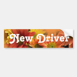 Nieuwe driver. Kleurrijke dagbloemen Bumpersticker