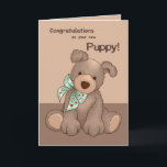 Nieuwe Puppy Gefeliciteerd, Hond met Groen Lint Kaart<br><div class="desc">Deze schattige pup,  die een groen lint met rode harten draagt,  zal zeker de harten winnen van degenen die de nieuwe hond hebben geadopteerd. Perfect voor elk hondenras.</div>