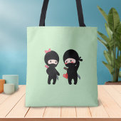 Ninja Pair, een jongen en een meisje op groen Tote Bag