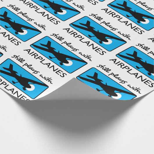 Nog steeds speelt met vliegtuigen cadeaupapier (Hoek)