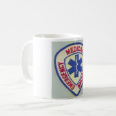 NOODMEDISCHE TECHNISCHE EMT KOFFIEMOK (Voorkant links)