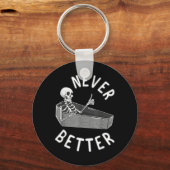 Nooit Beter Skelet Kist Schedel Grappige Halloween Sleutelhanger (Voorkant)