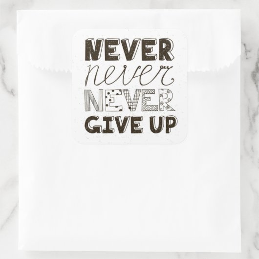 Nooit opgeven vierkante sticker (Tas)