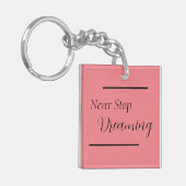 "Nooit stoppen met dromen" zinsnede zwart beletter Sleutelhanger (Voorkant Links)