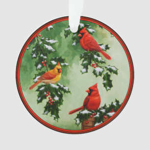 Noordelijke rode kardinalen en hulst ornament