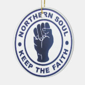 Noordelijke sol houdt de Faith Slgans en het eerst Keramisch Ornament (Links)