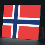 Noorse vlag fotoplaat<br><div class="desc">Voeg een vleugje Noorse trots toe aan uw huis of kantoor-decor met onze exclusieve plaquette met de Noorse vlag! Deze plaquette is gemaakt met nauwgezette aandacht voor detail en is meer dan alleen een decoratief item; het is een viering van het rijke erfgoed en de culturele identiteit van Noorwegen. Het...</div>