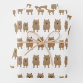 Norwich Terriers die papierbladen oppakken Inpakpapier Vel (In situ)