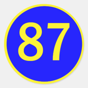 Nummer 87, in een cirkel ronde sticker