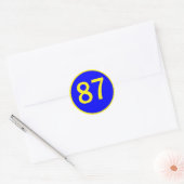 Nummer 87, in een cirkel ronde sticker (Envelop)