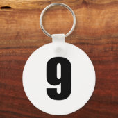 nummer 9 in zwart op witte sleutelhanger (Voorkant)