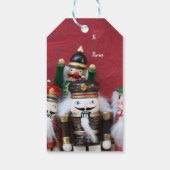 Nutkraakgroep op rood cadeaulabel (Achterkant)