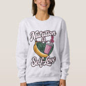 "Nutrition is Self-Love" Premium Unisex Longsleeve Trui (Voorkant)