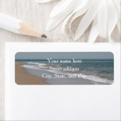 Oceaangolven en strand etiket (Insitu)