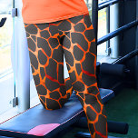 Oerwoud Giraffe afdrukken Leggings<br><div class="desc">Deze leggings zijn prachtig ontworpen met een betoverend sinaasappel en zwart giraffe vlekkenpatroon, en bieden een unieke en stijlvolle aanvulling op je garderobe. Het patroon toont de kenmerkende en elegante vlekken die kenmerkend zijn voor giraffen en creëert een verfijnde en opvallende look. De leggings zijn gemaakt van hoogwaardige en rekbare...</div>