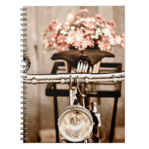 Old bicycle and flowers blur in background process notitieboek