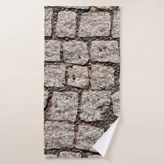 Old cobble stone pattern at the streetabstract, an badhanddoek (Badhanddoek)