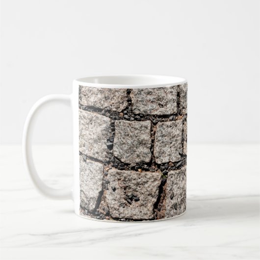 Old cobble stone pattern at the streetabstract, an koffiemok (Links)