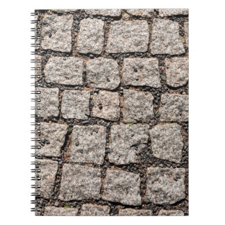 Old cobble stone pattern at the streetabstract, an notitieboek