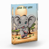 Olifant Baby springt vrolijk in Afrikaanse savanne Fotoblokken (Links)