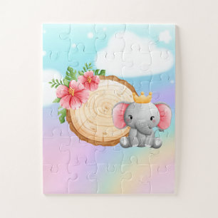 olifant zit naast een logboek met een bloempuzzel legpuzzel