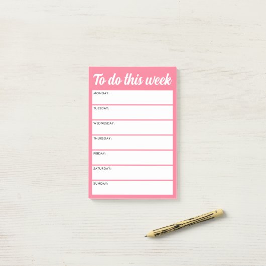 Om deze week roze weekplanner te doen post-it® notes (Op bureau)