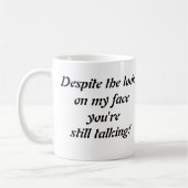 "Ondanks de blik op mijn gezicht..." koffie mok (Links)