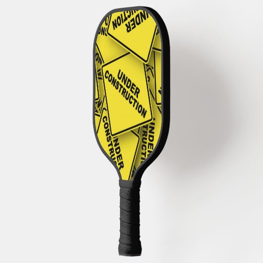 Onder constructietekens pickleball paddle (Links)
