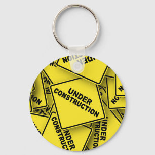 Onder constructietekens sleutelhanger