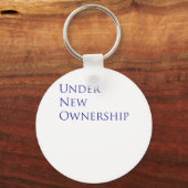 Onder nieuwe eigendom sleutelhanger (Voorkant)