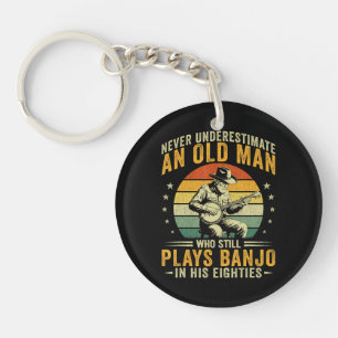 Onderschat nooit een oude man die banjo speelt sleutelhanger