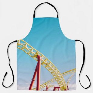 Onderzetter met gele en rode rol onder blauwe heme schort