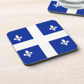 Onderzetter van harde kunststof met vlag van Quebe (Linkerzijde)