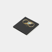 Oneindigheid met gouden pauwenveer post-it® notes (Schuin)