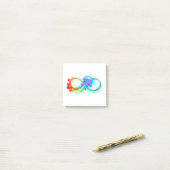 Oneindigheid met regenboogkwal post-it® notes (Op bureau)