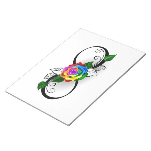 Oneindigheidssymbool met regenboogroos notitieblok (Schuin)