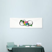 Oneindigheidssymbool met regenboogroos spandoek (Beurs)