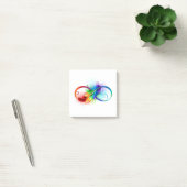 Oneindigheidssymbool met regenboogveer post-it® notes (Kantoor)