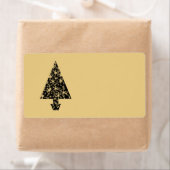 Ontwerp met een zwarte en gouden kerstboom. etiket (Insitu)