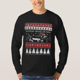 Oogstrelend kerstdachshund door de sneeuw t-shirt