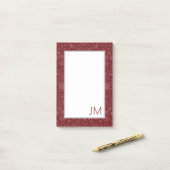 Oosterse stijl bloemenontwerp in donkerrood post-it® notes (Op bureau)