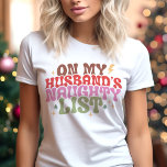 Op de ondeugende lijst van mijn man Funny Christma Tri-Blend Shirt<br><div class="desc">Voeg wat speelse humor toe aan je vakantiegarderobe met dit "Op de stoute lijst van mijn man" retro kerst shirt! Met gedurfde, geïnspireerde typografie in feestelijke kleuren en leuke sterrenaccenten is dit ontwerp ideaal voor het verspreiden van feestvreugde met een brutale twist. Ideaal voor feestjes, casual uitstapjes of als een...</div>