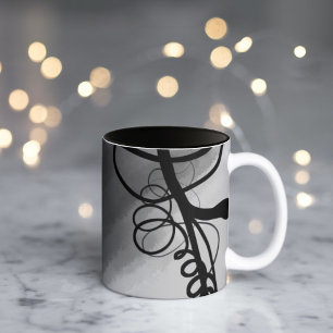 Op het raster: abstract grijs, zwart en wit tweekleurige koffiemok