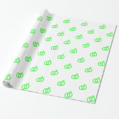 Op maat gemaakte limoengroene trouwringen op wit cadeaupapier (Uitgerold)