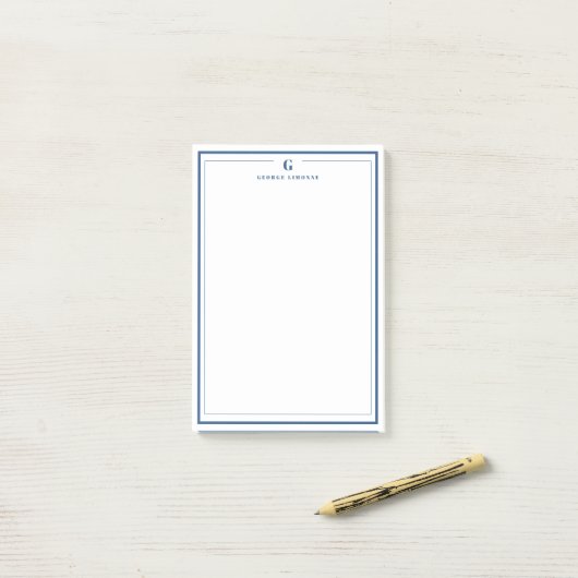 Op maat gemaakte monogram met een marineblauwe ran post-it® notes (Op bureau)