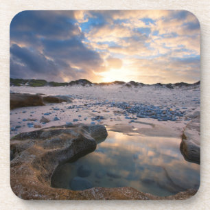 Op zonsondergang in een puddle bier onderzetter