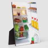 Open koelkast gevuld met voedsel fotoplaat (Zijkant)