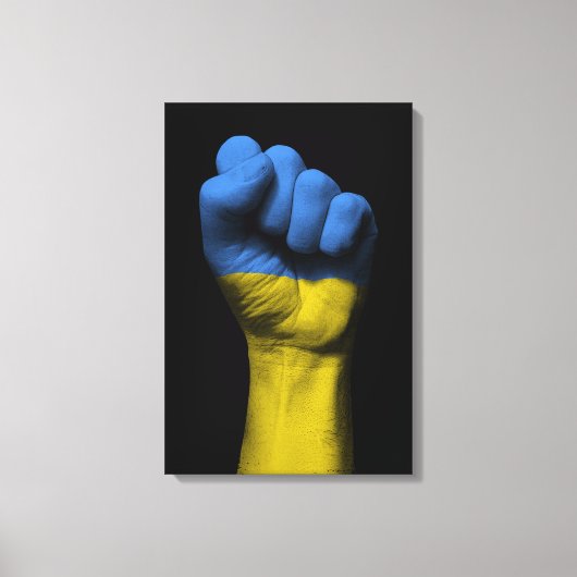Opgeheven gebalde vuist met Oekraïense vlag Canvas Afdruk (Voorkant)