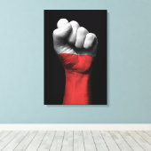 Opgeheven gebalde vuist met Poolse vlag Canvas Afdruk (Insitu (Houten vloer))