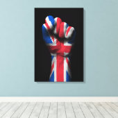 Opgeheven gebalde vuist met Union Jack Flag Canvas Afdruk (Insitu (Houten vloer))